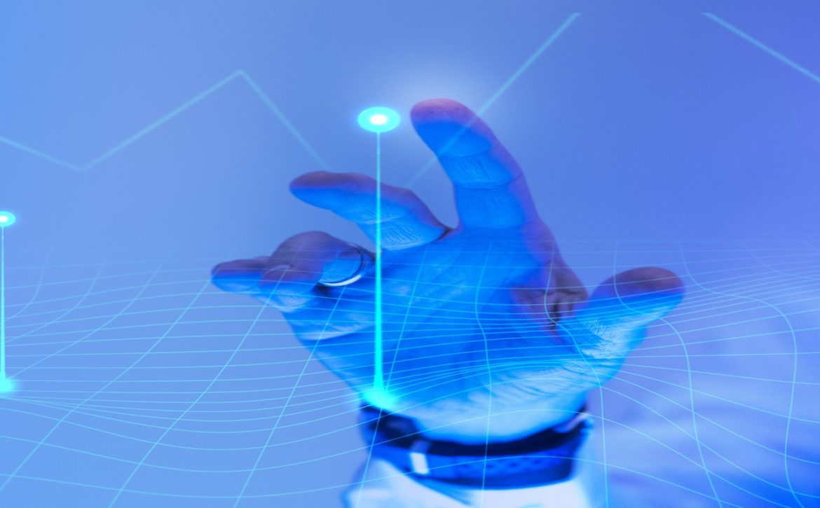 Man touching the futuristic blue screen
