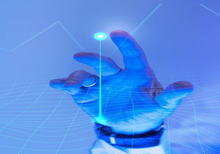 Man touching the futuristic blue screen